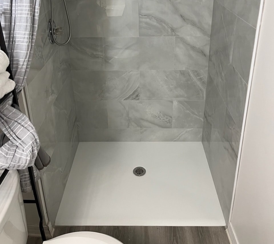 Modern bathroom with curbless shower system installation